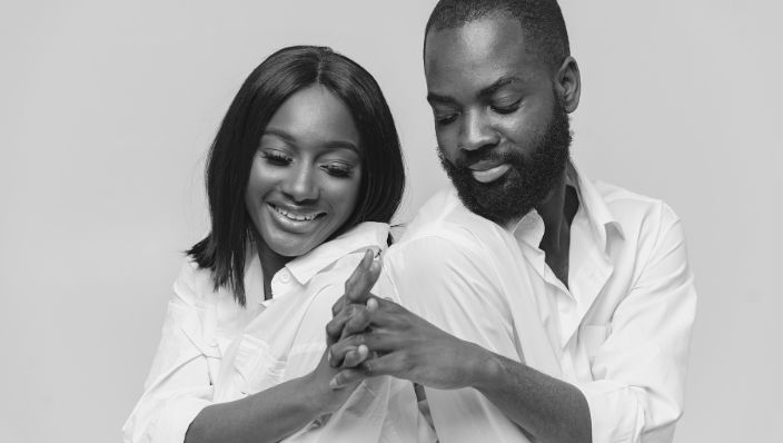 A couple interlocking hands